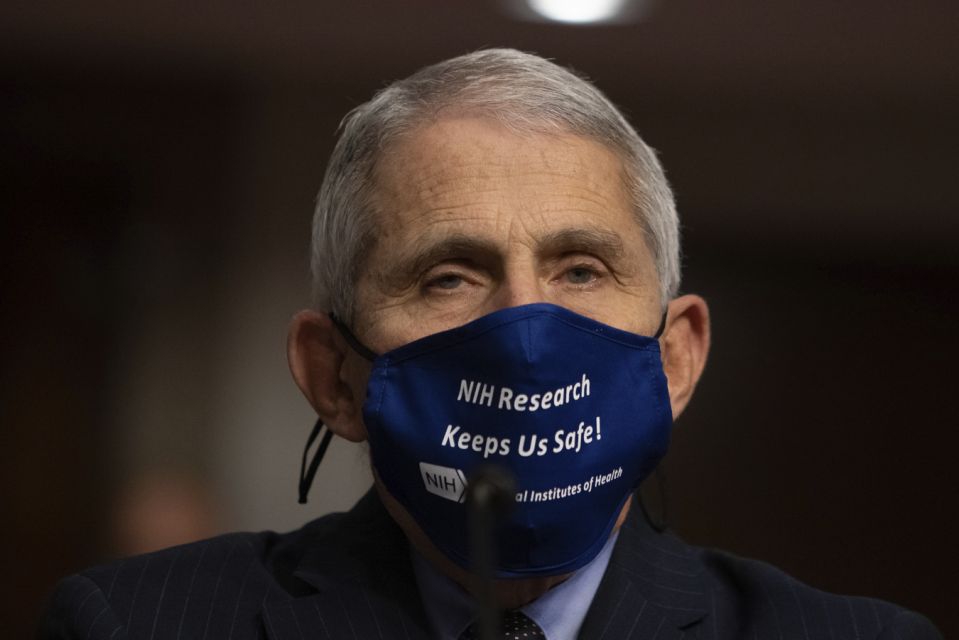 People should expect to wear masks and social distance through the end of 2021 and into 2022, Dr. Fauci  Said.